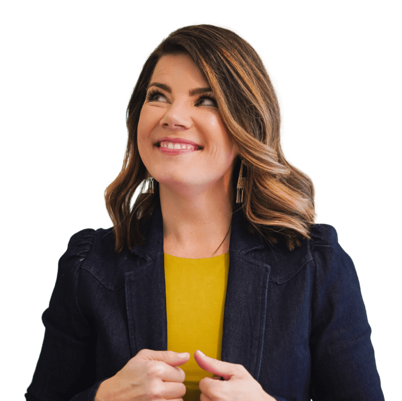 Smiling woman with shoulder-length hair wearing a yellow top and navy jacket looking upwards.